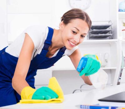 girl cleaning a kitchen